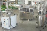 Enrobing machine with tanks melter