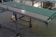Conveyor with belts with spheres of containment for high-speed paper sheets