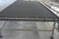 Conveyor with stainless steel mesh wire for trays on outlet oven
