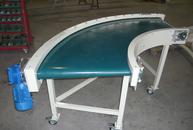90° belt conveyor with conical rollers in painted steel structure